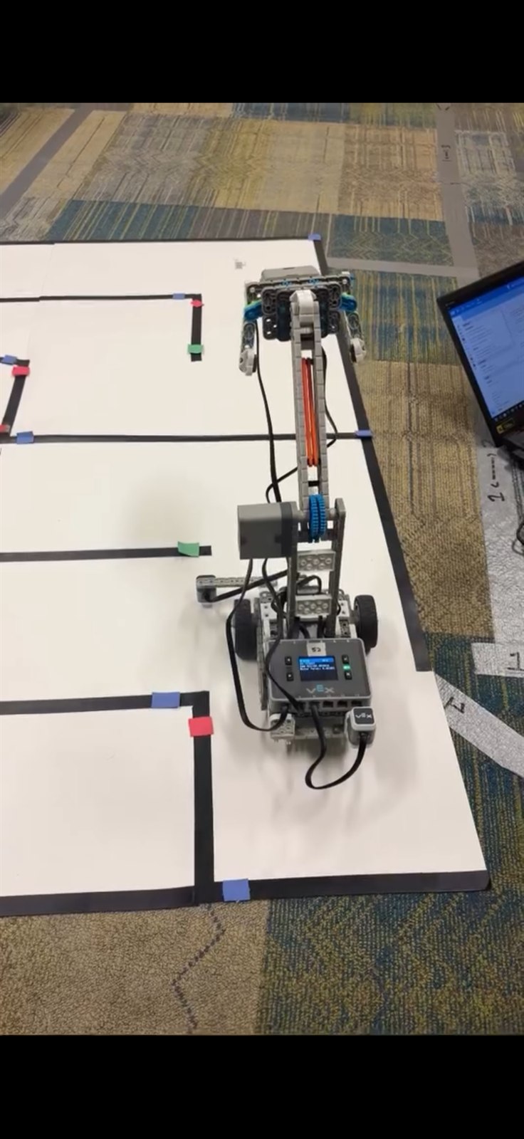 Autonomous VEX robot navigating the maze, control readout on the brain